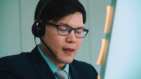 Business People Wearing Headset Working in Office