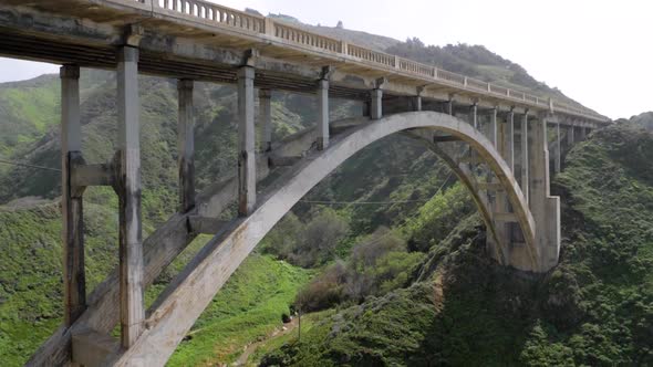 Ultra slow motion shot of Bixby Creek Bridge camera tilting up - California, USA