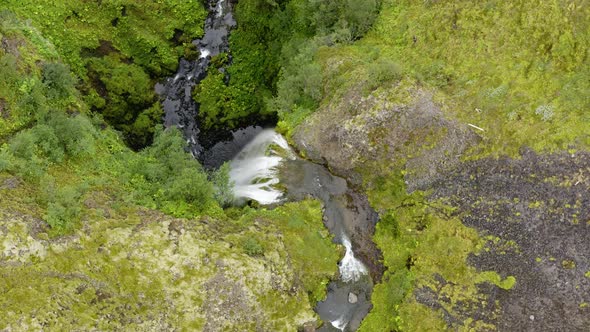 Bird's Eye View Of Nauthusagil Waterfall At Daytime In Iceland - aerial drone shot