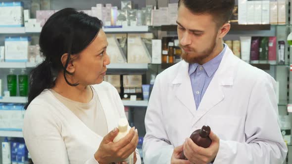 An Adult Woman Consults a Pharmacist About Remedy