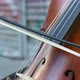 Young man is playing his cello at street as a close-up slow-motion view - VideoHive Item for Sale