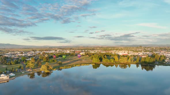 Hot Air Balloons rising and taking off during balloon festival in Hamilton, New Zealand. March 2022.