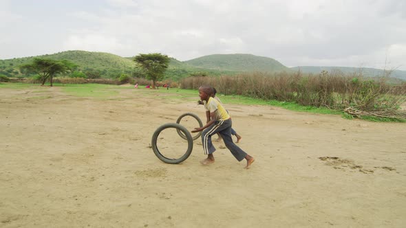 Children playing with wheels alt