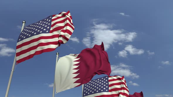 Row of Waving Flags of Qatar and the USA alt