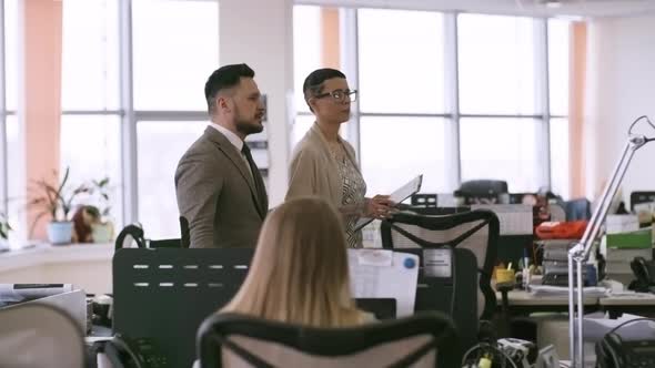 Businesswoman Showing Office to Male Colleague