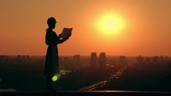 Female Architect in Hard Hat Scenic Town at Work