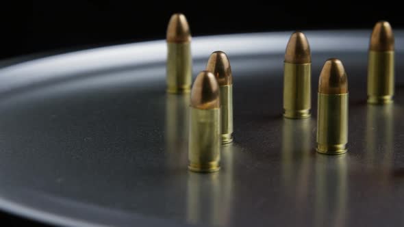 Cinematic rotating shot of bullets on a metallic surface - BULLETS 052