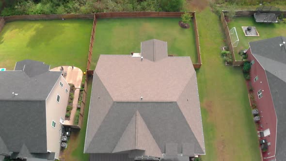 Aerial footage of a large middle class suburban home.