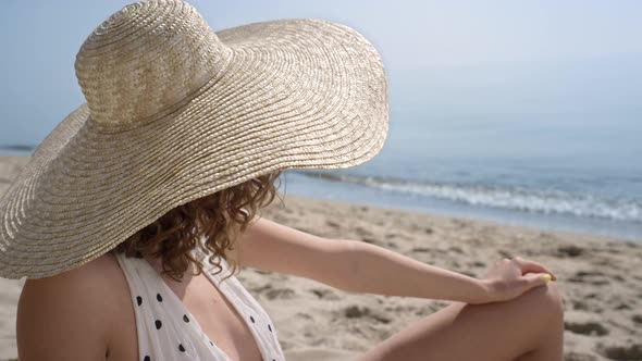 Stunning Woman Looking Camera Seductively Relaxing on Sunny Seacoast Close Up