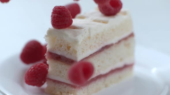 Raspberries falling on cake in slow motion; shot on Phantom Flex 4K at 1000 fps alt