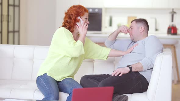 Stressed Worried Caucasian Woman Calling Ambulance As Man Having Symptoms of Heart Attack