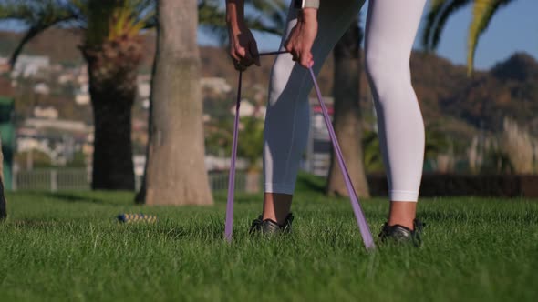 Young Lady Doing Bends While Training Outdoors