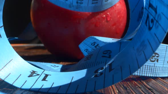 Red Apple Wrapped with Measuring Tape