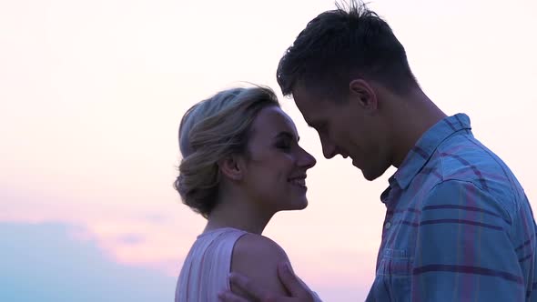 Young Man and Woman Enjoying Time Together Kissing Sunset, Honeymoon, Connection