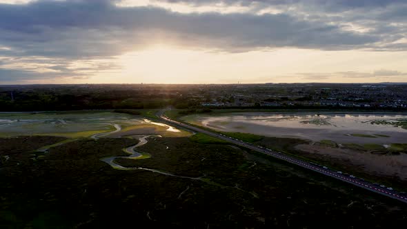 Drone rising over the Irish landscape at golden.