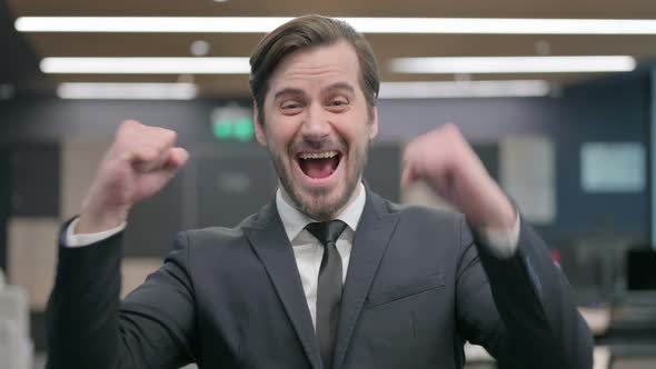 Portrait of Excited Businessman Celebrating Success
