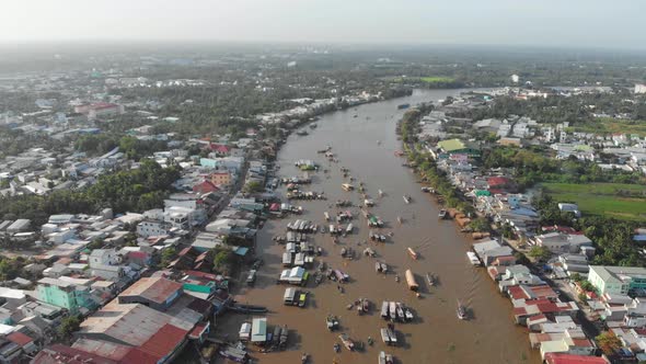 Aerial: flying over Cai Rang floating market in the morning, Can Tho, Vietnam