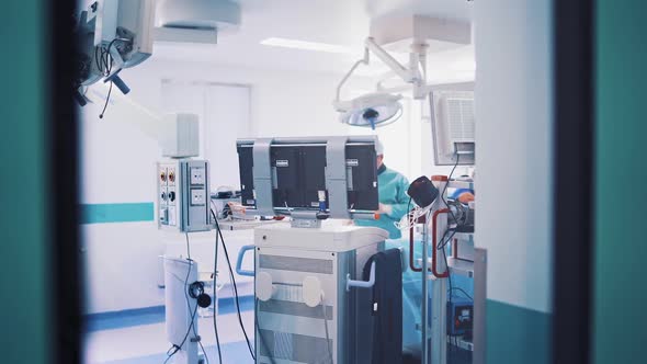 Operating room with modern equipment and surgeons in medical uniform