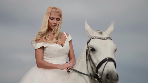 Amazing Beautiful Bride Dressed White Gorgeous Dress is Riding Horse Portrait of Romantic Lady