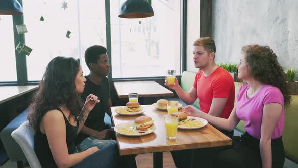 Group of Friends Talking in Cafe