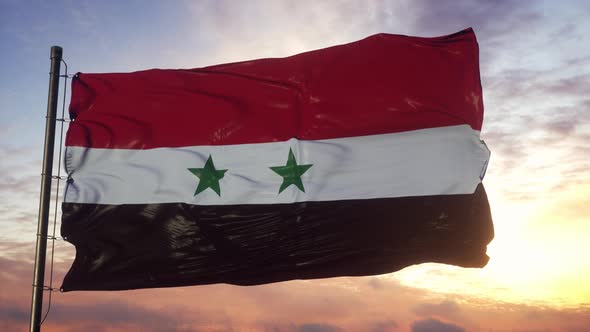 Flag of Syria Waving in the Wind Against Deep Beautiful Sky at Sunset