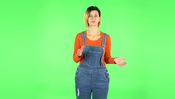 Girl Claps Her Hands Indifferently. Green Screen