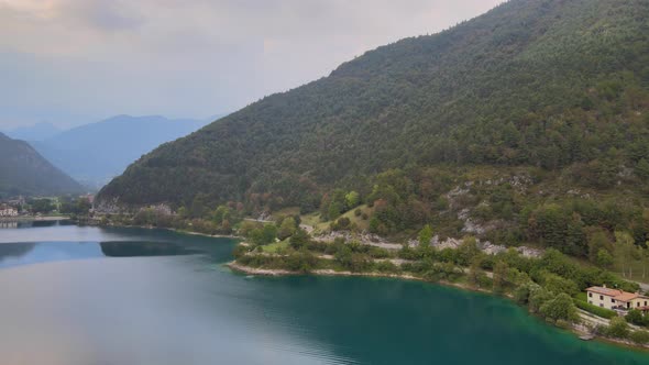 Coastal road by beautiful Ledro Lake in Northern Italy. Aerial panoramic view