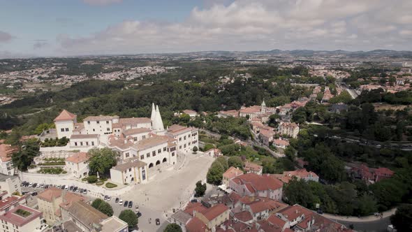 Set of buildings of Sintra National Palace with two conical chimneys standing out. Aerial view