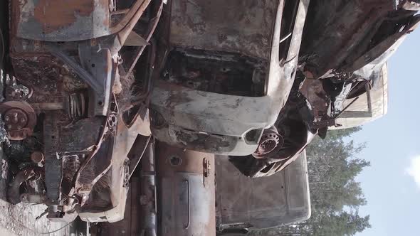 Vertical Video Irpin Ukraine  Burnt and Destroyed Cars