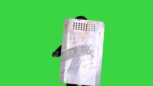 Riot Police Unit with the Shield Up and Baton Moving Towards Camera on a Green Screen Chroma Key