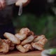 Chief Removes Grilled Chicken Wings From the Skewers - VideoHive Item for Sale