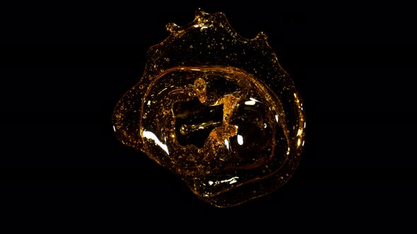 Super Slow Motion Shot of Rotating Oil Whirl Isolated on Black Background at 1000Fps