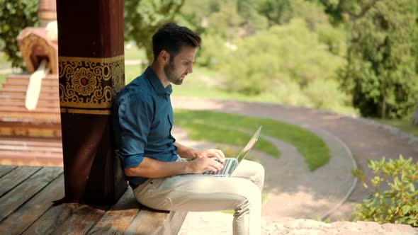 Freelancer Internet Online Meeting Webinar. Man Freelance With Computer Outdoors. Typing On Laptop.