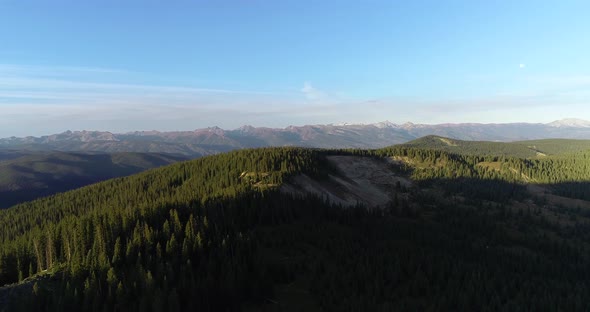 Rocky Mountain forests and peaks in this aerial shot.