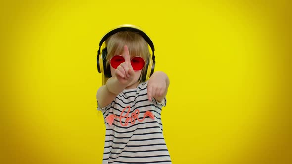 Playful Funny Little Kid Child Girl Listening Music Via Headphones Dancing Disco Fooling Having Fun