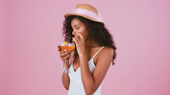 Darkskinned Woman in Hat Jewelry and White Dress