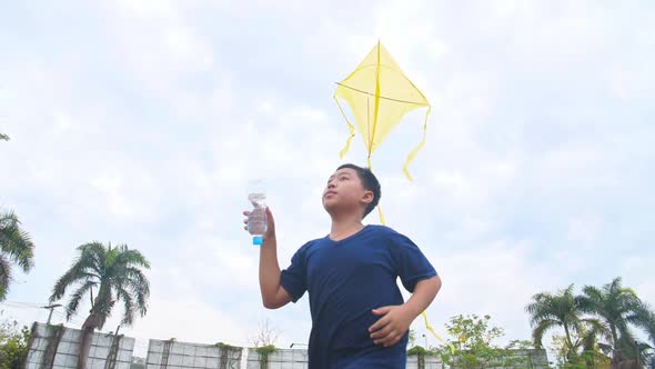 Asian Boy Playing Kite