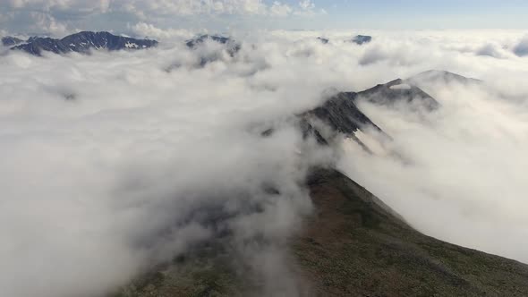 Hill Ridges Over the Clouds