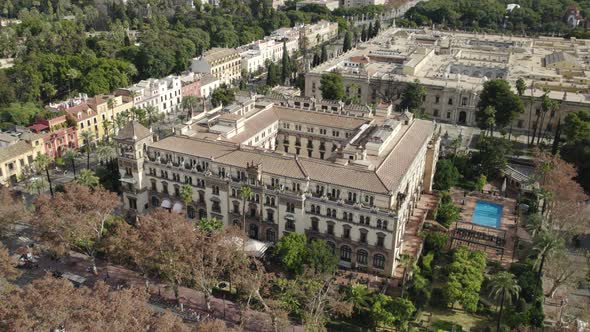 Drone pan around 5-star Hotel Alfonso XIII, luxury hotel in Seville, Spain