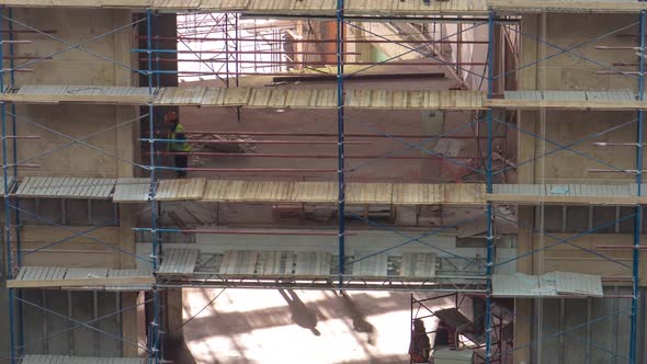 Construction Equipment Material with Scaffolding and Tools Inside the Floor of High Rising Building