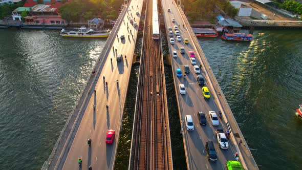 4K : Drones fly over the Chao Phraya River. Aerial view over bts skytrain