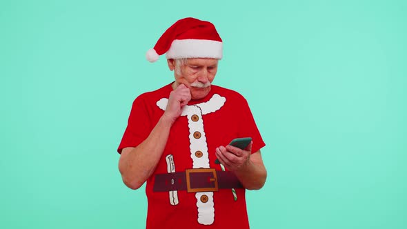 Senior Grandfather Using Mobile Phone Typing New Post on Web Christmas Shopping Online Browsing