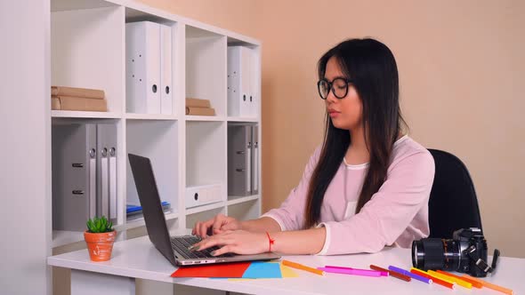 Photographer Using Pc at Work