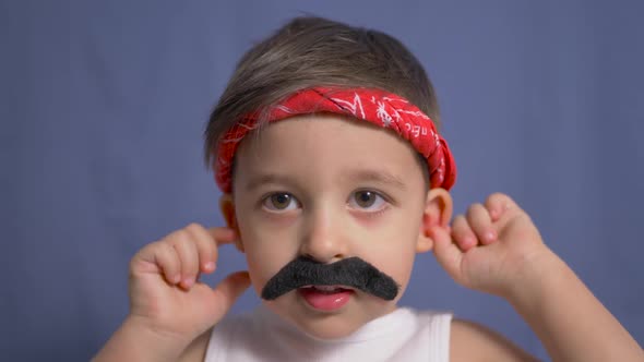 Funny Mexican Boy with a Big Black Mustache and a White t Shirt