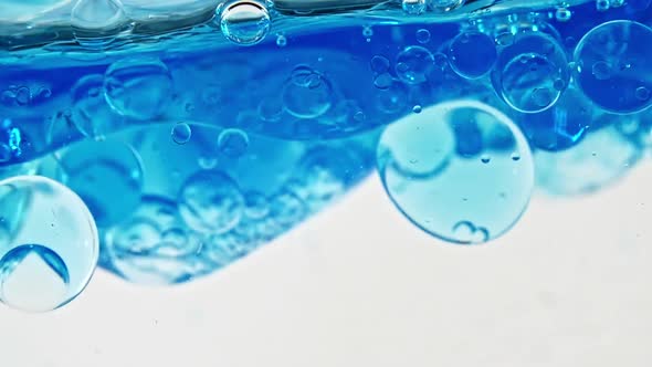 Blue Wave Water with Bubbles on White Background alt