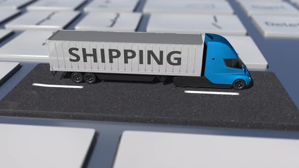 SHIPPING Text on the Truck Driving on the Keyboard Key