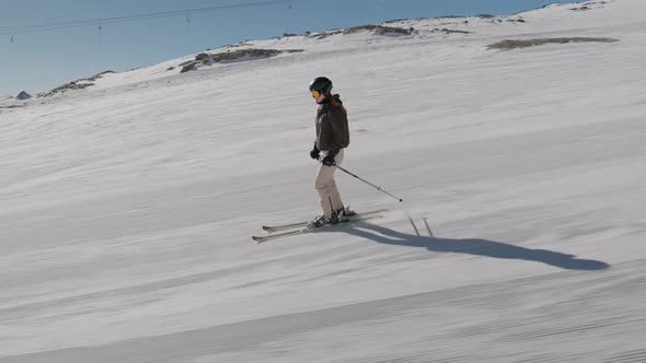 Woman Skiing Downhill Slope