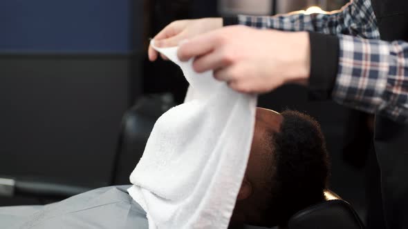 Barber Shaving His Client with Classical Razor