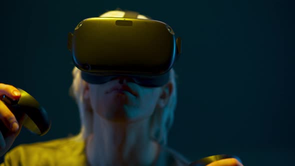 Impressed Man Experiencing VR Headset Videogame Neon Background