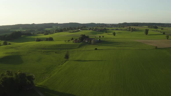 Aerial zoom in establishing shot of rural farm set in central europe, germany